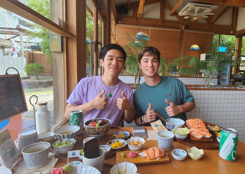 NSLI-Y Placement Korean/South Korea: Manton and Noah eating a special lunch provided to them after getting the right answer to a question during a lecture by the principal of Sinheung High School