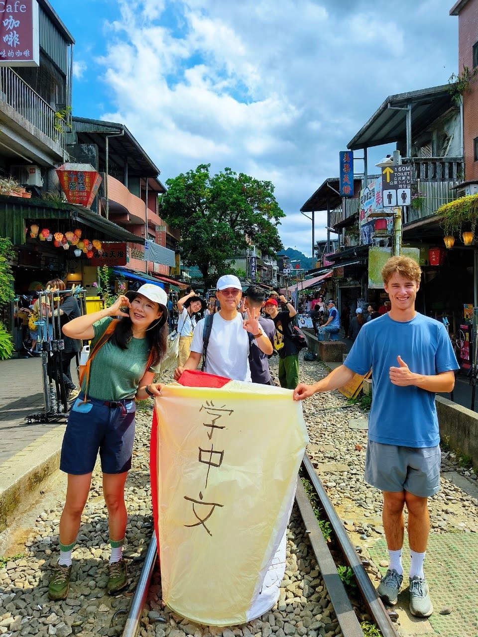 Students pose in the street for a photo in Taiwan