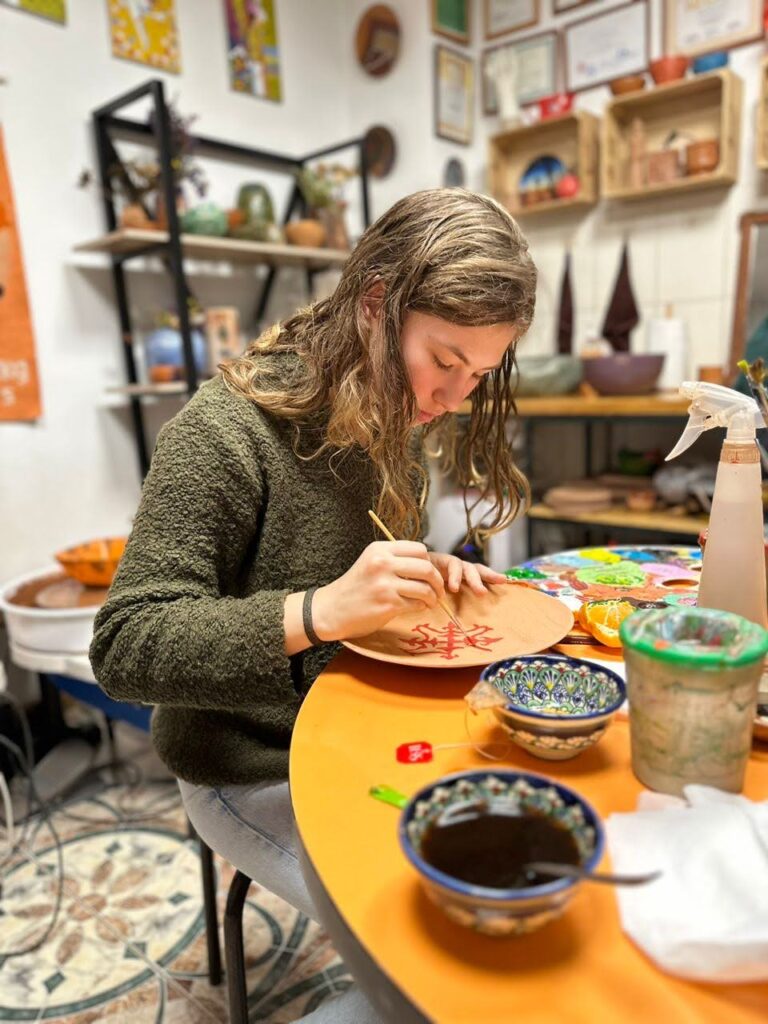 NSLI-Y Arabic participant painting traditional Moroccan patterns