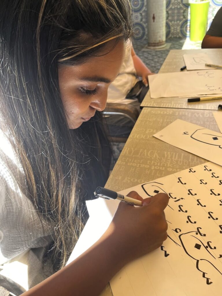 NSLI-Y Arabic language participant practicing her script in Morocco