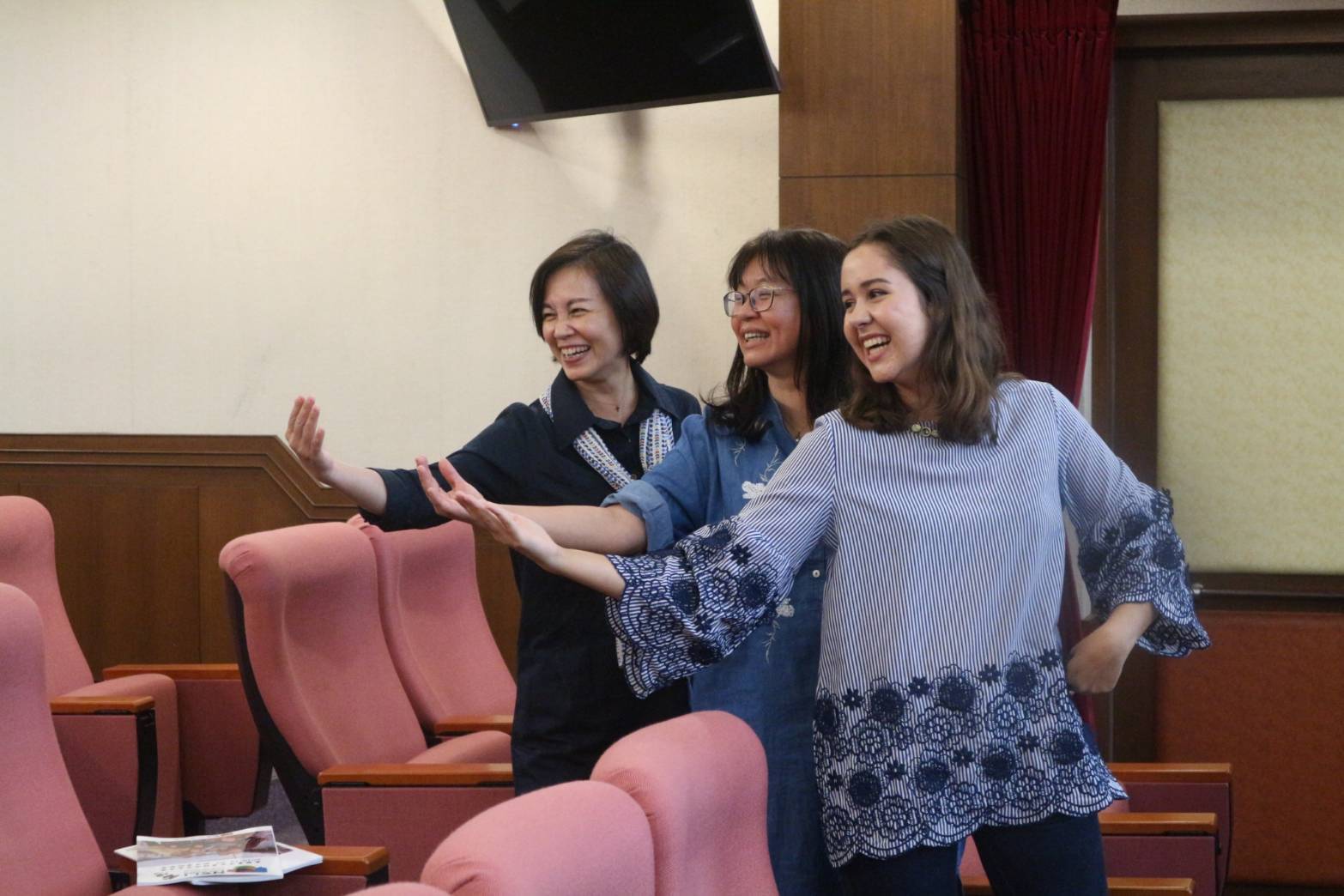 Ingrid posing with two peers in Taiwan