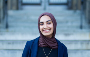 An Arabic language alumna smiles for the camera