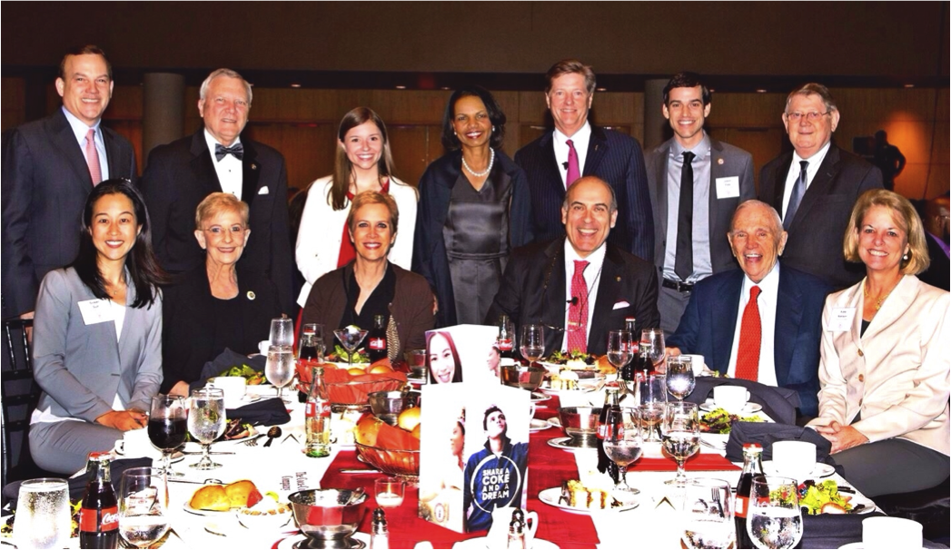image of state department officials posing together at a dinner table