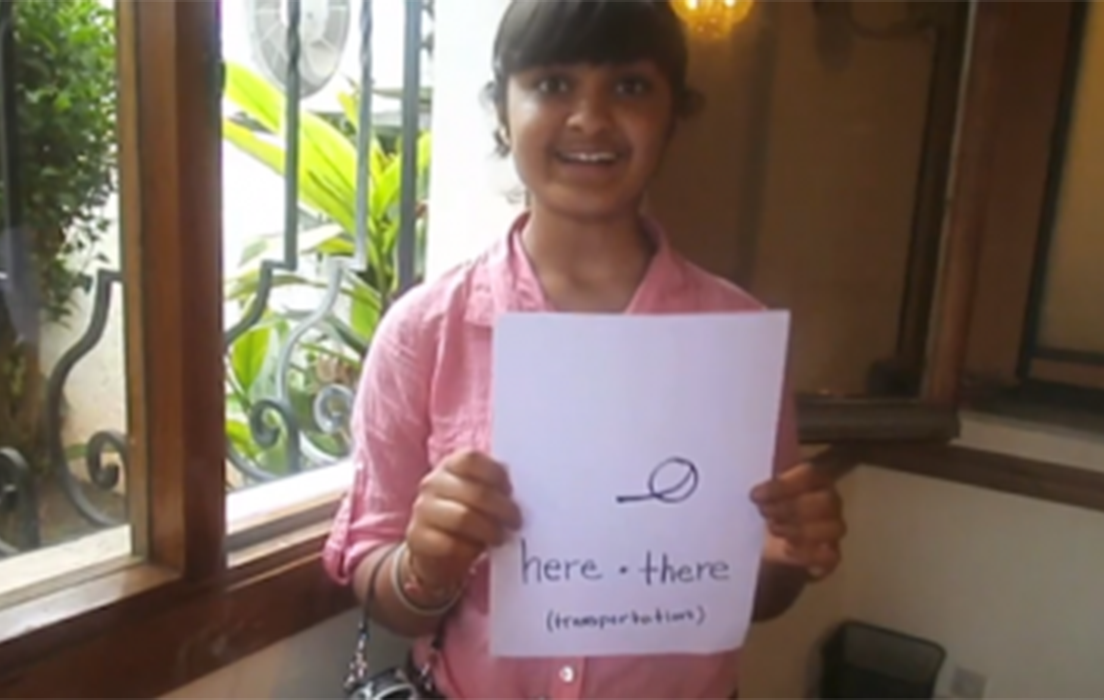 image of nsli-y student holding a piece of paper that reads
