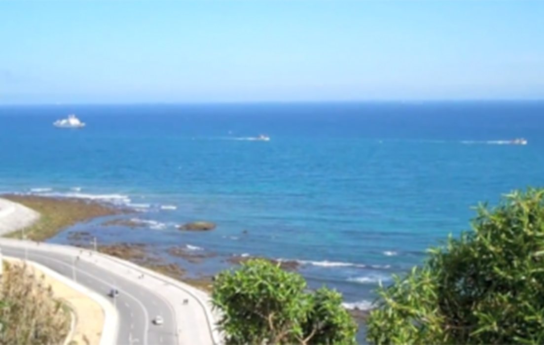 image of a bright blue sea from an elevated ledge in tangier