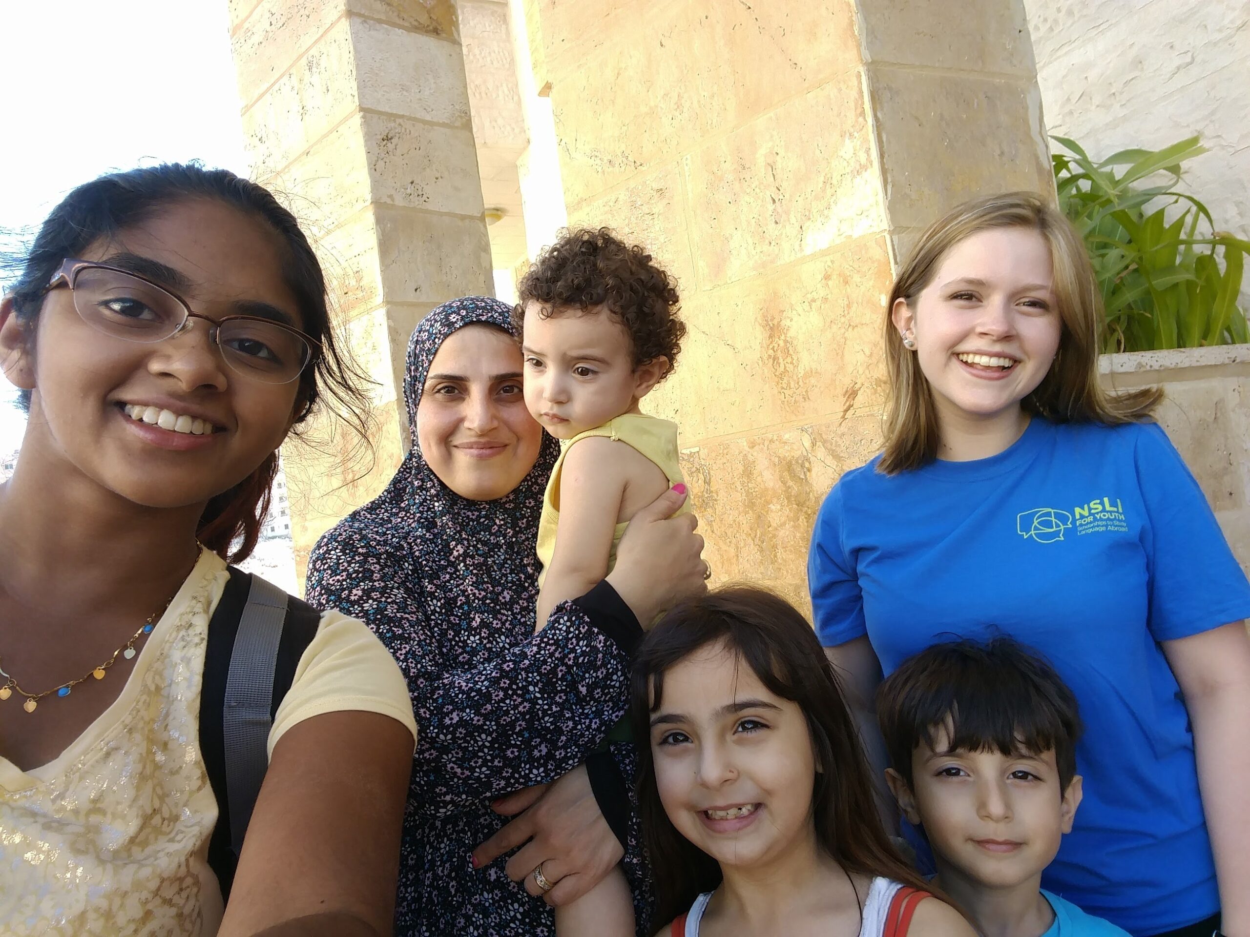 Meenu taking a selfie along with her host family and NSLI-Y peer
