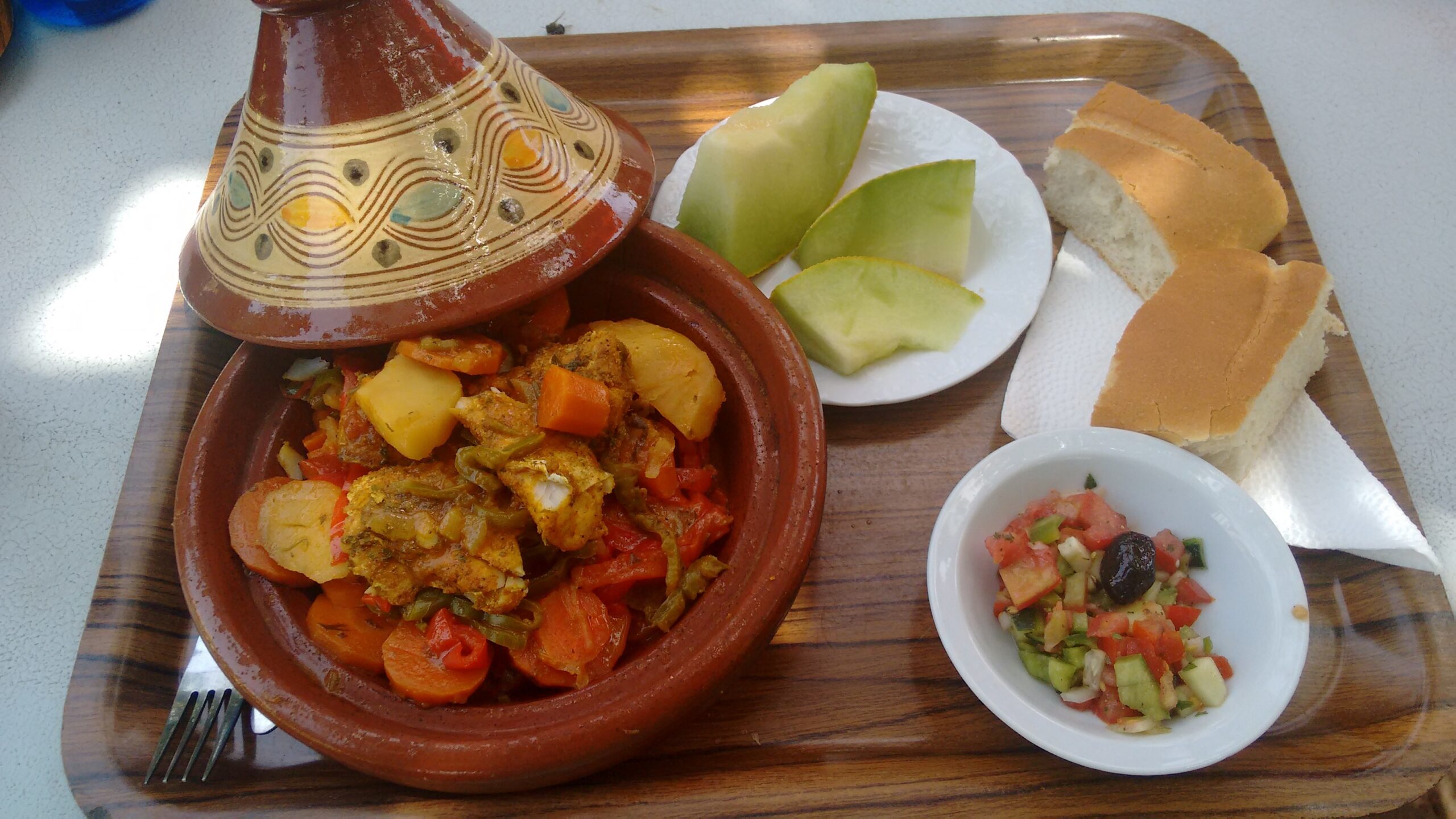 an image of a Moroccan tagine and fruit