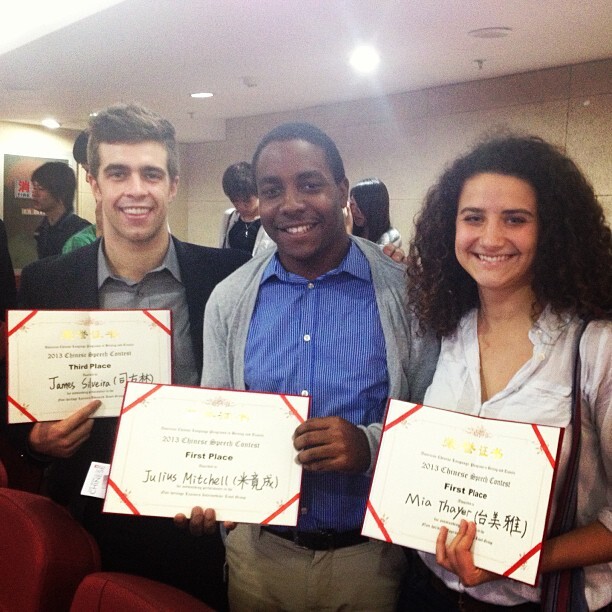Image of Julius with his completion certificate and two of his peers smiling and holding theirs