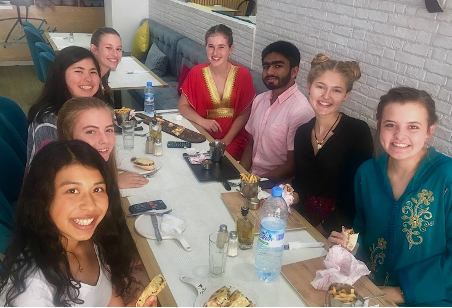 Mikaela at a restaurant in Morocco with her fellow cohort members
