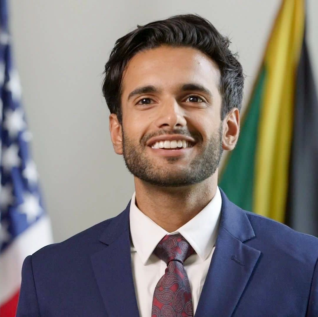 Image of Salman in front of the US flag