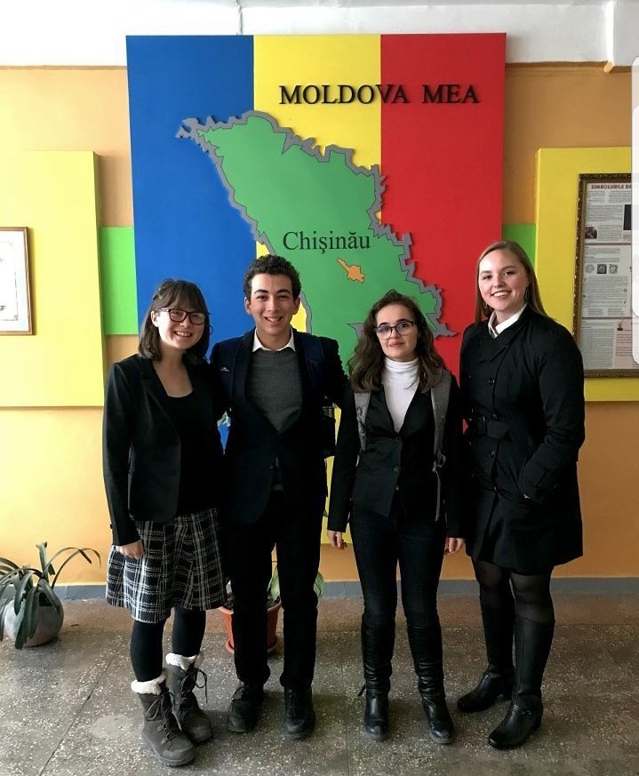 An image of NSLI-Y students posing in front of a map of Moldova