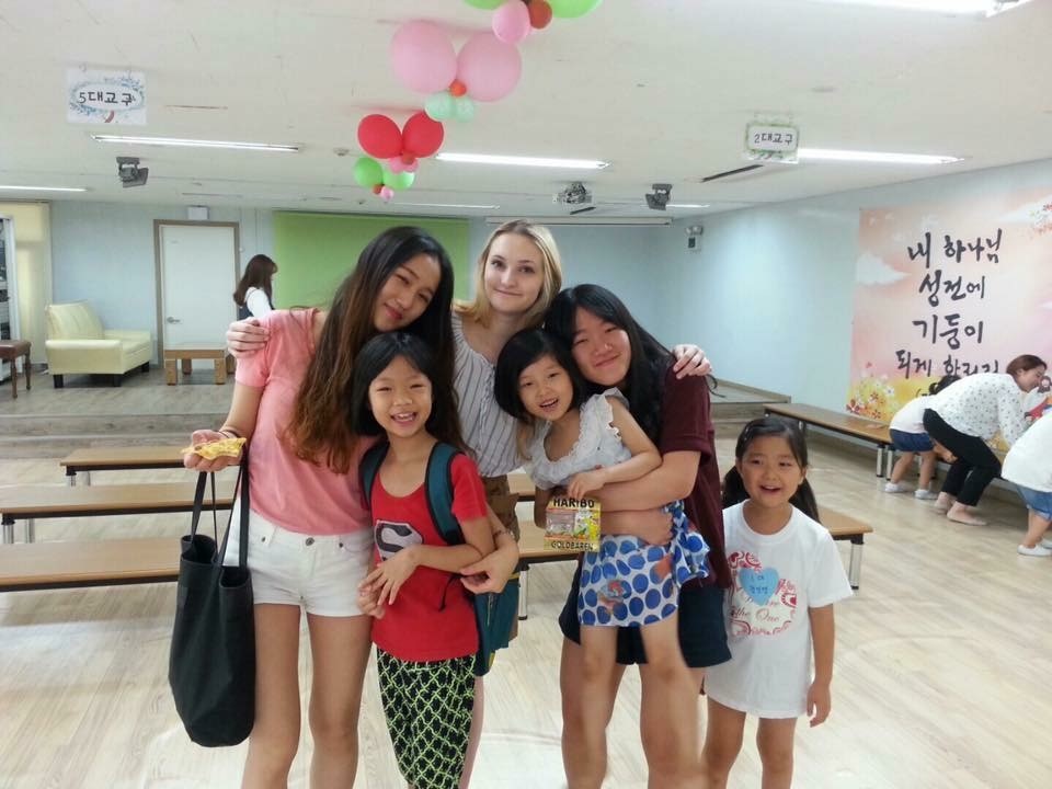 NSLI-Y alumna Annalise stands with her five host siblings in South Korea
